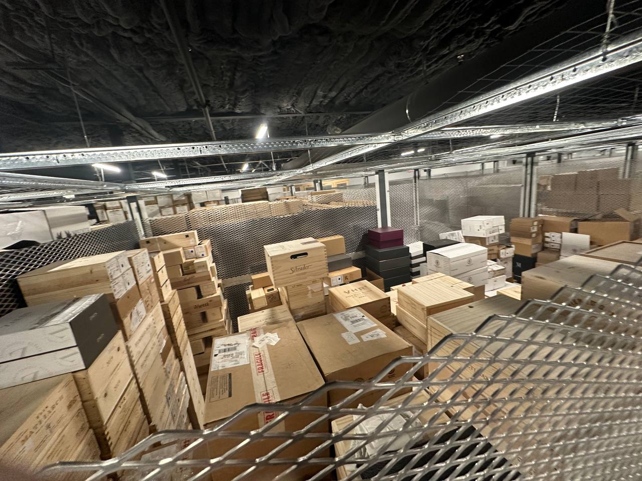 Secure caged storage compartments at Carl's Wine Vault